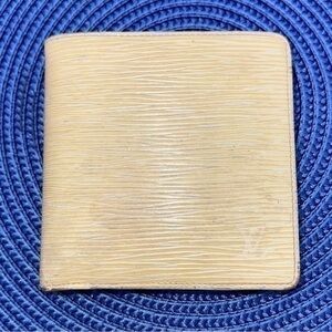 AUTHENTIC Louis Vuitton Marco Wallet. Previously owned. Light yellow.